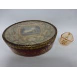 An early 19th Century Regency oval Cranberry glass casket with gilt decoration to the side and with