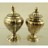 A VICTORIAN SILVER PEPPER POT, of lidded urn form, London 1849, 9cm high, together with ONE OTHER