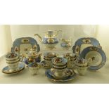 AN EXTENSIVE VICTORIAN TEASET, blue border with gilded cartouches of hand painted summer flowers