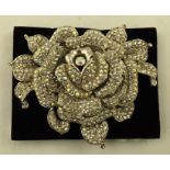 A BUTLER & WILSON BROOCH of generous proportion, floral design, set diamante, 12cm wide