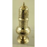 SAMUEL WOOD A GEORGE II SILVER SUGAR CASTER, having floral repousse decoration, on circular platform