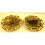 A PAIR OF ROYAL DOULTON EARTHENWARE WALL PLATTERS each decorated with African game, bull elephants