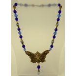 A CZECH 1930's GILT METAL ANGEL NECKLACE with facetted blue crystal beads, 44cm long