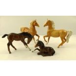 A COLLECTION OF BESWICK EARTHENWARE HORSES, two Palomino foals with left leg up, one foal brown