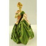 A ROYAL WORCESTER BONE CHINA FIGURE "FIRST DANCE" a fair haired young lady in green dress with