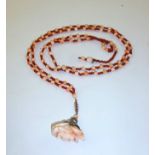 AN ANGEL SKIN CORAL CARVED CAMEO ROSE PENDANT SAUTOIR, 120cm long