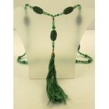 A JADE & GREEN CINNABAR NECKLACE fashioned with carved bird ovals, 80cm long