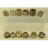 A COLLECTION OF TWELVE SILVER NAPKIN RINGS, mixed assays, combined weight approximately 272g.