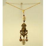 NEIGER BROTHERS AN EGYPTIAN REVIVAL GILT METAL PENDANT with carved glass beetle droppers, 50cm long