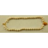 A CULTURED PEARL UNIFORM TWO-ROW BRACELET, on gilt metal clasp, 19cm long