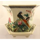 A 20TH CENTURY CHINESE PLANTER AND STAND, decorated in the famille rose palette with birds on a