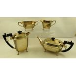 POSSIBLY BY J. COLLYER & CO. LTD. A GEORGE V FOUR-PIECE SILVER TEA SET of canted rectangular form,
