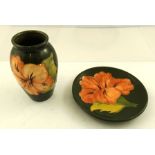 A MOORCROFT EARTHENWARE VASE ovoid green with salmon pink hibiscus, 10.5cm high, impressed mark