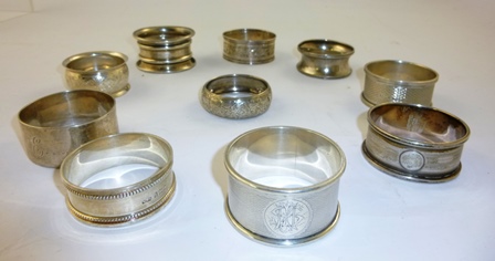 AN ASSORTMENT OF TEN VARIOUS SILVER NAPKIN RINGS to include bright cut bead and other patterns,