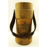 A LATE GEORGIAN CANVAS POWDER FLASK with crest to front and up-over leather handle, 35cm high