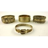 A SELECTION OF FOUR VARIOUS SILVER BANGLES with buckle, bead and floral cut decoration, mixed