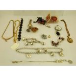 A QUANTITY OF COSTUME JEWELLERY, to include a silver heart mounted suite bearing the names "Tiffany"