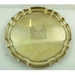 JOSEPH GLOSTER LTD. A CHIPPENDALE STYLE SILVER SALVER, having pie crust rim, bears two figure