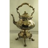 A LATE VICTORIAN SILVER PLATED SPIRIT KETTLE repousse decorated, on a floral cast stand, bears