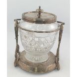 A CUT GLASS BISCUIT BARREL with plated cover and stand, fitted swing handle, 19cm high