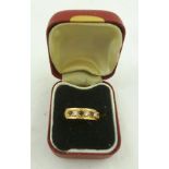 A 9CT GOLD DRESS RING set with red and white stones, size N