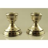 BROADWAY & CO. A PAIR OF SPUN SILVER WEIGHTED DWARF CANDLESTICKS, having felted bases, Birmingham