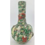 A QING DYNASTY FAMILLE VERTE BOTTLE FORM VASE of moulded reticulated form, with Lohan amongst clouds