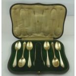 MAPPIN & WEBB A SET OF SIX SILVER COFFEE SPOONS AND MATCHING TONGS, with shaped terminals, Sheffield