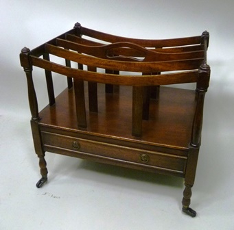 A GEORGIAN DESIGN MAHOGANY CANTERBURY with central carrying handles, the base fitted a drawer, on