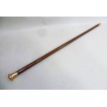 A 15CT GOLD TOPPED GENTLEMAN'S MALACCA WALKING CANE, having mushroom knop and horn tip, Birmingham