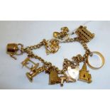 A 9CT. GOLD CURB LINK BRACELET with padlock clasp with nine charms and a 22ct. gold wedding band