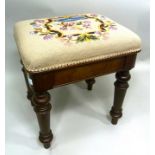 A VICTORIAN MAHOGANY FRAMED STOOL having woolwork upholstered seat, supported on turned supports