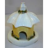 A 19TH CENTURY STAFFORDSHIRE POTTERY PASTILLE BURNER in the form of a cottage with umbrella roof,