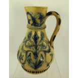 T. SMITH AND CO. A SALT GLAZED STONEWARE JUG with incised acanthus leaf decoration, blue glazed in