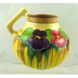 CLARICE CLIFF A 1930'S BALUSTER CARAFE having angular handle and decorated in "Pansies" pattern,