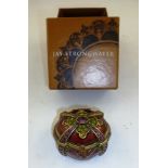 A DECORATIVE ENAMELLED AND STONE SET PILL BOX of casket form 5cm, with original box