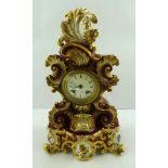 A 19TH CENTURY FRENCH POTTERY CASED EIGHT DAY MANTEL CLOCK, the Rococo design with hand painted