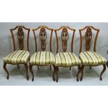 A SET OF FOUR EDWARDIAN SINGLE CHAIRS, each having pierced decorative splats, upholstered stuff-over