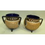 A MATCHED PAIR OF EARLY 20TH CENTURY DOULTON LAMBETH THREE HANDLED "TYG" VASES, each with cobalt