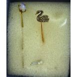 A DIAMOND MOUNTED GOLD TIE PIN fashioned as a Swan set with 20 bruted stones and another GOLD TIE