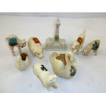 A SELECTION OF EIGHT PORCELAIN COMMEMORATIVES, to include a Willow dog, an Arcadia swan, a foreign