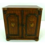 AN EDWARDIAN OAK SMOKERS COMPANION BOX, modelled in the form of a safe with two ebonised mounted