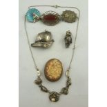 A SELECTION OF SILVER AND SILVER COLOURED ITEMS, to include a cameo brooch, teddy bear charm,