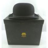 A LINCOLN BENNETT AND CO. LTD. "PICCADILLY" TOP HAT in carrying case, 7 6/8" together with a