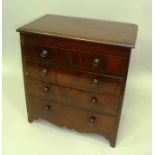 A 19TH CENTURY MAHOGANY MINIATURE/SAMPLE CHEST OF DRAWERS fitted two short over three long