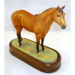 A ROYAL WORCESTER MODEL OF AN AMERICAN REGISTERED QUARTER HORSE, modelled by Doris Lindner, no.