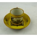 A 19TH CENTURY MEISSEN COFFEE CAN AND SAUCER, yellow ground with hand painted en grisaille river