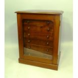 A LATE VICTORIAN MAHOGANY COLLECTOR'S CABINET having glazed door revealing seven graduated drawers