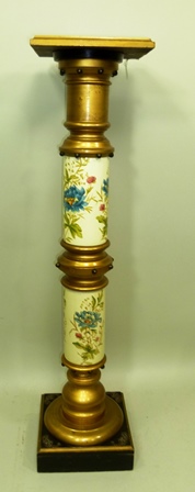 AN EDWARDIAN AESTHETIC DESIGN TORCHERE, ebonised and gilt wood, with hand coloured ceramic stem,