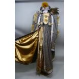 A 20TH CENTURY TUDOR DESIGN COSTUME with hanging sleeves, bodice, skirt, hat, fan and purse